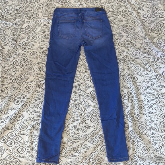 Bright blue skinny jeans. - Picture 2 of 2